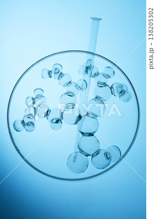 Abstract cosmetic lab. Glass molecule structure with test tube in petri dish Abstract cosmetic lab. Glass molecule structure with test tube in petri dish 138205302