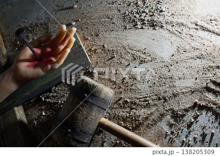 Hand nailed on wood symbolizing crucifixion and suffering 138205309