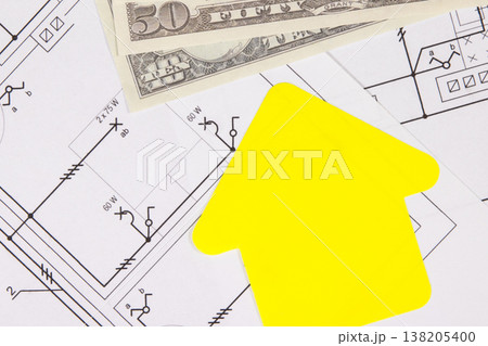 Dollar banknotes, paper in shape of house, construction drawing of electric installation 138205400