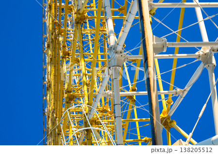 Close-up of white and yellow structural steel truss joints on a modern amusement park ride Close-up of white and yellow structural steel truss joints on a modern amusement park ride 138205512