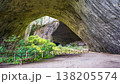 Devetashka Cave Interior with Wooden Fence and Bench on Dirt Path 138205574