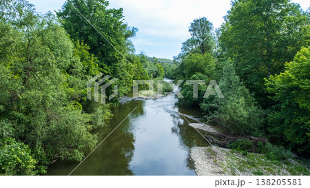 Serene River Landscape Surrounded by Lush Green Vegetation in Bulgaria Serene River Landscape Surrounded by Lush Green Vegetation in Bulgaria 138205581
