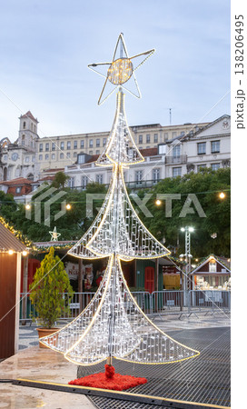 Christmas market stalls illuminated decorations festive tree in historic Lisbon center Portugal 138206495