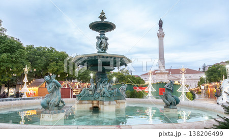 Decorative fountain in city square surrounded by Christmas market Decorative fountain in city square surrounded by Christmas market 138206499