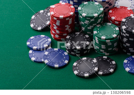 Multicolored casino chips as a conceptual backdrop for gambling games. Multicolored casino chips 138206598