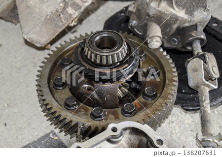 Dismantled box car transmissions. The gears on the shaft of a mechanical transmission. Dismantled box car transmissions. The gears on the shaft of a mechanical transmission. 138207631