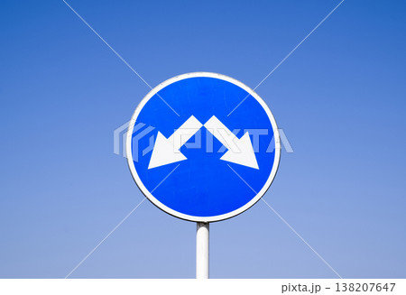 The sign of the crossing. Road signs. Sign on a blue background The sign of the crossing. Road signs. Sign on a blue background 138207647