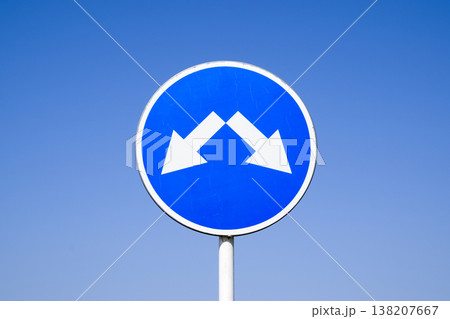 The sign of the crossing. Road signs. Sign on a blue background The sign of the crossing. Road signs. Sign on a blue background 138207667