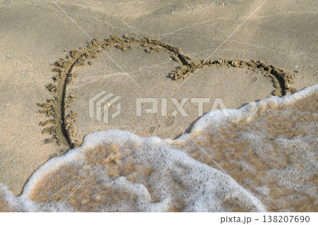 Heart drawn on the beach sand Heart drawn on the beach sand 138207690