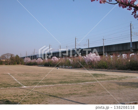 北陸新幹線「E7系/W7系」(2015.3.30) が春の熊谷市運動公園を通過 サッカーGRDと桜 北陸新幹線「E7系/W7系」(2015.3.30) が春の熊谷市運動公園を通過 サッカーGRDと桜 138208118