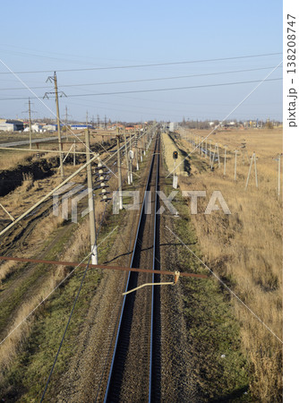 Plot railway. Top view on the rails. High-voltage power lines for electric trains 138208747