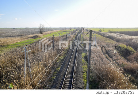 Plot railway. Top view on the rails. High-voltage power lines for electric trains 138208755