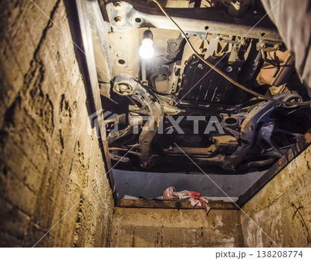 View of the car from below. Autoservice center. Car maintenance. 138208774