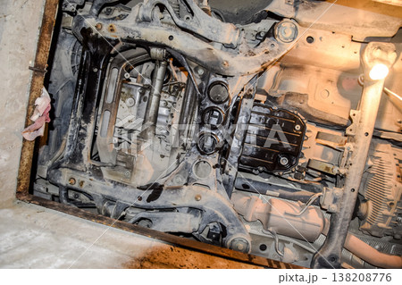 View of the car from below. Autoservice center. Car maintenance. View of the car from below. Autoservice center. Car maintenance. 138208776