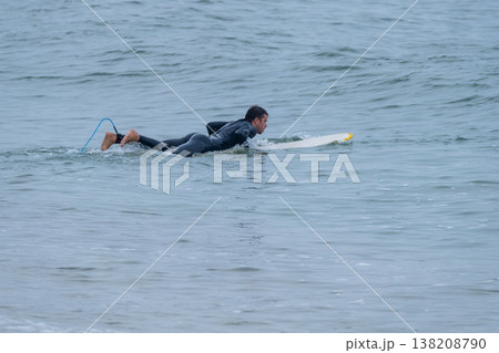 Surfer on longboard over the water Surfer on longboard over the water 138208790
