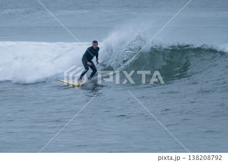 Surfer in action on the ocean waves Surfer in action on the ocean waves 138208792