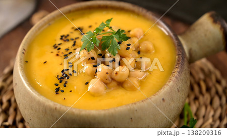 Creamy Butternut Squash Soup Topped with Roasted Chickpeas and Black Sesame Seeds Creamy Butternut Squash Soup Topped with Roasted Chickpeas and Black Sesame Seeds 138209316