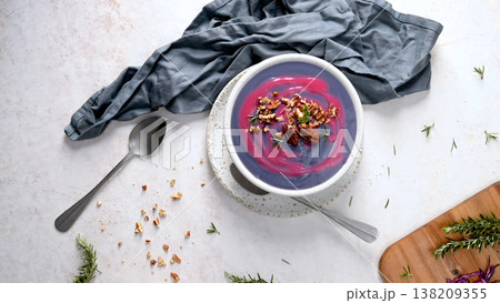 Vibrant Purple Sweet Potato Soup with Pecans and Rosemary 138209355