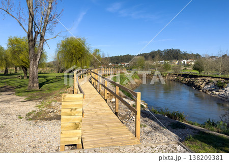 Wooden boardwalk winding alongside the Antua River at Parque Municipal do Antua Wooden boardwalk winding alongside the Antua River at Parque Municipal do Antua 138209381