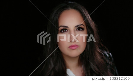 Confidence and Self-Esteem Portrait of a Serious Young Woman With Dark Hair and Pink Lipstick Confidence and Self-Esteem Portrait of a Serious Young Woman With Dark Hair and Pink Lipstick 138212109
