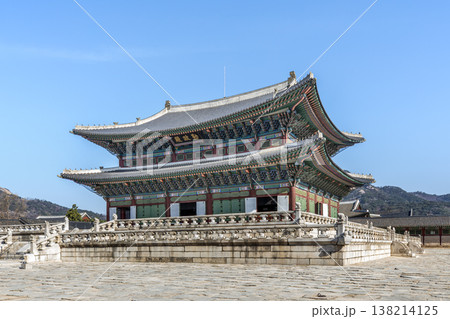 Traditional Korean Royal Architecture of Geunjeongjeon Hall under a Clear Blue Sky. 138214125