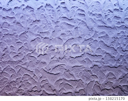 Rough textured concrete wall painted in a lavender hue. Rough textured concrete wall painted in a lavender hue. 138215170
