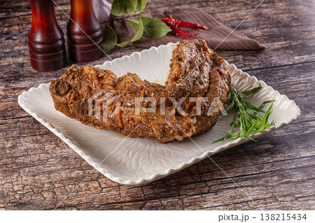 Baked pork sirloin with spices Baked pork sirloin with spices 138215434