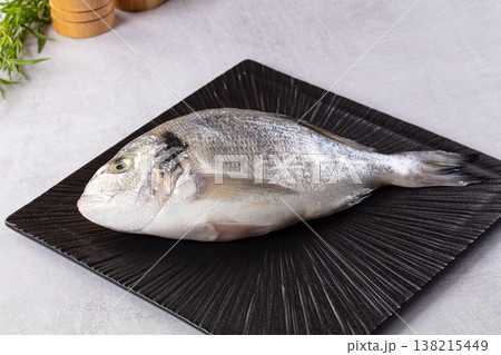 Raw fresh uncooked dorada fish Raw fresh uncooked dorada fish 138215449