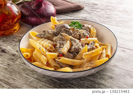 Italian pasta penne with chicken liver 138215461