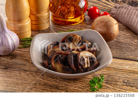 Fried champignon slices in the plate Fried champignon slices in the plate 138215508