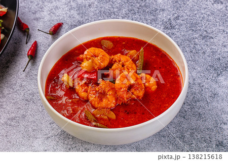 Spicy shrimp soup Red Thai Curry with prawns and vegetables in a vibrant red broth. Asian cuisine concept. Spicy shrimp soup Red Thai Curry with prawns and vegetables in a vibrant red broth. Asian cuisine concept. 138215618