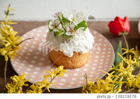 Close up of Easter cake decorated with spring flowers. Close up of Easter cake decorated with spring flowers. 138219176