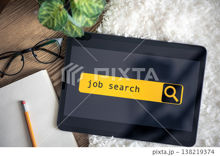 Top view of digital tablet with search job on screen on a table. 138219374