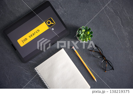 Top view of digital tablet with search job on screen on a table. 138219375