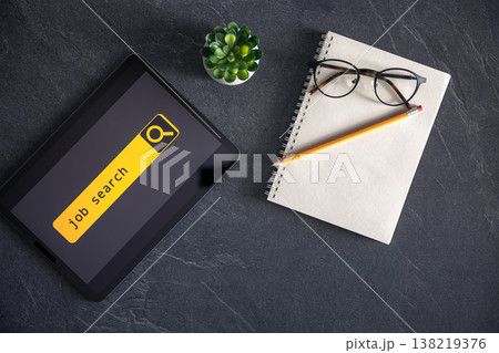 Top view of digital tablet with search job on screen on a table. 138219376