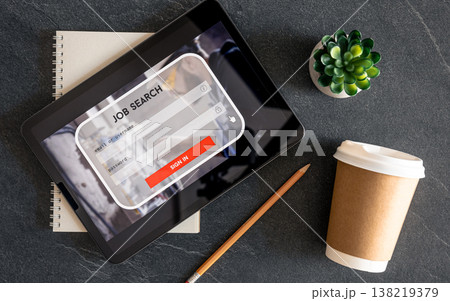 Top view of digital tablet with search job on screen on a table. Top view of digital tablet with search job on screen on a table. 138219379