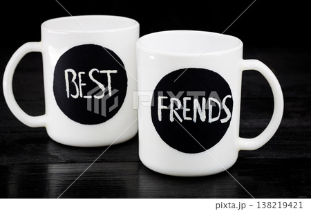 two white cups with the inscription two white cups with the inscription 138219421