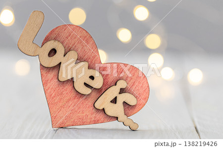 Valentine's background with decorative wooden heart Love it and bokeh lights. 138219426