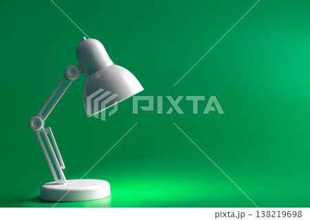 White table lamp on a green background, copy space. 138219698