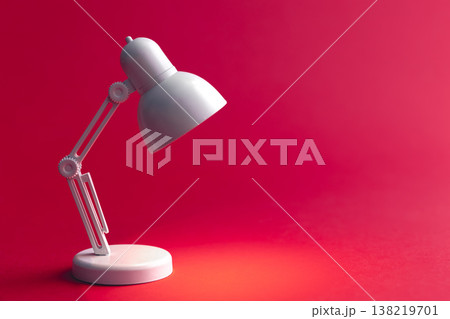 White table lamp on a Viva Magenta background, copy space. 138219701