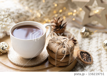 Winter composition with a cup of cocoa and marshmallows on a blurred background. Winter composition with a cup of cocoa and marshmallows on a blurred background. 138219731
