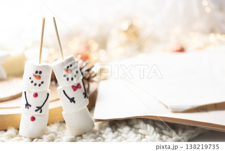 Winter composition with a cup of cocoa and marshmallows on a blurred background. Winter composition with a cup of cocoa and marshmallows on a blurred background. 138219735