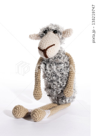 Crocheted sheep toy on a white background Crocheted sheep toy on a white background 138219747
