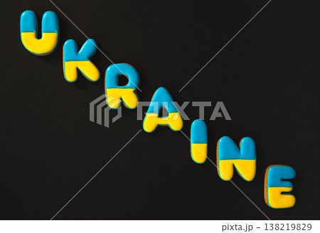 The word Ukraine on a black background, made with handmade gingerbread. 138219829