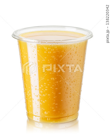 Disposable plastic glass of cold orange juice isolated on white background 138220342