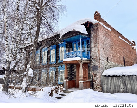 restored two-storey house in an urban-type settlement in winter restored two-storey house in an urban-type settlement in winter 138221108