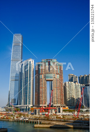 Modern skyscraper towers of West Kowloon district against blue sky in Hong Kong cityscape 138221744