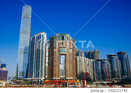 Modern skyscraper towers of West Kowloon district against blue sky in Hong Kong cityscape 138221745