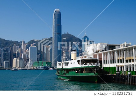 Green Star Ferry boat on Victoria Harbour Pier with Hong Kong island skyline background Green Star Ferry boat on Victoria Harbour Pier with Hong Kong island skyline background 138221753