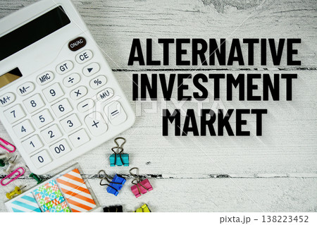 AIM Alternative Investment Market text message with calculator and stationery on wooden background AIM Alternative Investment Market text message with calculator and stationery on wooden background 138223452